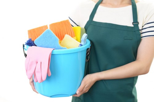Carpet cleaning team preparing equipment with safety precautions